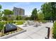 Inviting outdoor lounge area features comfortable seating, a fountain, and lush landscaping at 2660 Peachtree Nw Rd # 10H, Atlanta, GA 30305