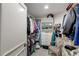 Well-organized walk-in closet with ample storage space for clothes, shoes, and accessories at 2660 Peachtree Nw Rd # 10H, Atlanta, GA 30305