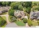 Sprawling estate nestled among mature trees, featuring a pool, meticulously landscaped grounds, and neighboring luxury homes at 3770 Riverly Trce, Marietta, GA 30067