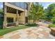 Backyard featuring an outdoor living space with stone pillars, lush grass, and a pool area at 3770 Riverly Trce, Marietta, GA 30067