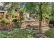 Expansive backyard featuring a stone retaining wall with stairs leading to the pool and entertainment area at 3770 Riverly Trce, Marietta, GA 30067