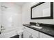 Contemporary bathroom featuring a bathtub, toilet and vanity with dark counter at 3770 Riverly Trce, Marietta, GA 30067