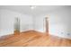 Bright bedroom with hardwood floors and walk-in closet entrances at 3770 Riverly Trce, Marietta, GA 30067