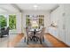 Bright breakfast nook with modern cabinets, a central table, and views of the landscaped yard at 3770 Riverly Trce, Marietta, GA 30067