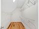 Walk-in closet with wooden floors and shelves for organization at 3770 Riverly Trce, Marietta, GA 30067
