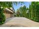 Long driveway to a spacious three-car garage and a basketball hoop, perfect for Gathering fun at 3770 Riverly Trce, Marietta, GA 30067