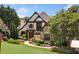 Stately home boasts meticulously landscaped grounds and a stone-accented facade at 3770 Riverly Trce, Marietta, GA 30067