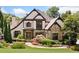 Charming home showcasing a stone and tan exterior with a meticulously landscaped front yard and inviting front entrance at 3770 Riverly Trce, Marietta, GA 30067