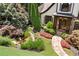 Beautifully landscaped front yard with a stone walkway, pond, and mature trees, enhancing the home's curb appeal at 3770 Riverly Trce, Marietta, GA 30067
