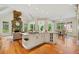 Open kitchen featuring center island with cooktop, breakfast bar, and a cozy breakfast nook at 3770 Riverly Trce, Marietta, GA 30067