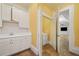 Well-lit laundry room with ample storage, a sink, and easy access to the adjacent room at 3770 Riverly Trce, Marietta, GA 30067