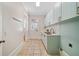 Practical laundry room with sage cabinets, marble countertops, and tiled flooring at 3770 Riverly Trce, Marietta, GA 30067