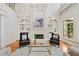 Sophisticated living room featuring fireplace with custom shelving and a cozy seating area at 3770 Riverly Trce, Marietta, GA 30067