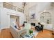 Inviting living room with a fireplace, gleaming hardwoods, and refined architectural details at 3770 Riverly Trce, Marietta, GA 30067