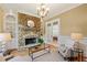 Cozy living room with stone fireplace, built-in shelves, and natural light at 3770 Riverly Trce, Marietta, GA 30067