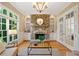 Bright living room with stone fireplace, built-in shelves, and hardwood floors at 3770 Riverly Trce, Marietta, GA 30067