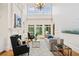 Bright living room with hardwood floors, fireplace, and large windows offering lots of natural light at 3770 Riverly Trce, Marietta, GA 30067