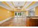 Living room with tile flooring, wet bar, and access to the pool area at 3770 Riverly Trce, Marietta, GA 30067
