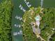 Aerial view showcases the community pool and multiple boat docks with access to the lake at 1000 Delta Dr, Canton, GA 30114