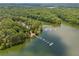 Beautiful aerial view with lush trees, lake and docks, offering waterfront living and recreation at 1000 Delta Dr, Canton, GA 30114