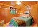 Cozy bedroom featuring wood paneling, ample natural light, and a comfortable bed at 1000 Delta Dr, Canton, GA 30114