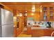 Well-maintained kitchen with wood cabinets and modern appliances, offering a functional cooking space at 1000 Delta Dr, Canton, GA 30114