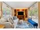Bright living room featuring ample natural light, a comfortable sofa, and stylish decor at 1000 Delta Dr, Canton, GA 30114