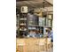 Hip bar area with liquor shelves, wood counter, and patrons at 22 Airline Ne St # 201, Atlanta, GA 30312