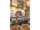 Stylish bar area with a chef preparing food, ample seating, and decorative shelves stocked with sake bottles at 22 Airline Ne St # 201, Atlanta, GA 30312