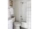 Traditional bathroom with white fixtures, tiled shower, and neutral decor at 22 Airline Ne St # 201, Atlanta, GA 30312