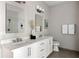 Spacious bathroom with double vanity, a white tiled shower, and modern fixtures at 22 Airline Ne St # 201, Atlanta, GA 30312