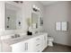 Spacious bathroom with double vanity, modern fixtures, and a walk-in shower with white subway tile at 22 Airline Ne St # 201, Atlanta, GA 30312
