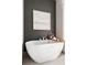 Elegant soaking tub with a tray, candles, and a painting, creating a relaxing spa-like ambiance at 22 Airline Ne St # 201, Atlanta, GA 30312