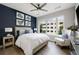 Comfortable bedroom with a cozy bed, artwork, and a large window offering natural light at 22 Airline Ne St # 201, Atlanta, GA 30312