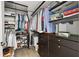 Walk-in closet with custom shelving, hanging rods, and storage drawers for optimal organization at 22 Airline Ne St # 201, Atlanta, GA 30312