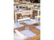 Outdoor dining area with wooden tables and seating set for a meal at Yeppa 69 at 22 Airline Ne St # 201, Atlanta, GA 30312