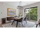 Dining room with modern decor, art, and balcony access, creating an inviting and stylish space at 22 Airline Ne St # 201, Atlanta, GA 30312