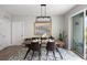 Dining room with elegant table setting, art, and access to the balcony, perfect for entertaining guests at 22 Airline Ne St # 201, Atlanta, GA 30312