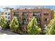 Beautiful brick apartment building with balconies, mature trees, and street view at 22 Airline Ne St # 201, Atlanta, GA 30312