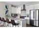 Modern kitchen featuring stainless steel appliances, white cabinets, and a breakfast bar at 22 Airline Ne St # 201, Atlanta, GA 30312