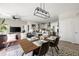 Open-concept living and dining area with modern lighting, wood floors, and a view of the kitchen at 22 Airline Ne St # 201, Atlanta, GA 30312