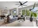 Bright living room featuring a gray sectional sofa, glass table, and large windows with natural light at 22 Airline Ne St # 201, Atlanta, GA 30312