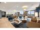 Expansive community lounge area with comfortable seating, modern lighting, and a partial kitchen at 22 Airline Ne St # 201, Atlanta, GA 30312