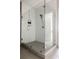 Modern walk-in shower with frameless glass enclosure and white subway tile surround at 22 Airline Ne St # 201, Atlanta, GA 30312