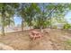 A backyard featuring an outdoor area with a wooden picnic table at 568 Musical Ct, Lawrenceville, GA 30044