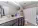 Well-lit bathroom with double sink vanity, mirror, and shower with bathtub combo at 568 Musical Ct, Lawrenceville, GA 30044