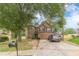 Attractive two-story home with stone accents, a two-car garage and a well-kept lawn at 568 Musical Ct, Lawrenceville, GA 30044