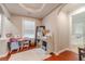 Hallway featuring hardwood floors and a view to a room, including an adjacent bathroom at 568 Musical Ct, Lawrenceville, GA 30044