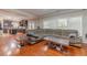 Spacious living room with an open layout, hardwood floors, and a seamless transition to the kitchen at 568 Musical Ct, Lawrenceville, GA 30044