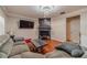 Living room features a fireplace, mounted TV, and ample seating perfect for entertaining at 568 Musical Ct, Lawrenceville, GA 30044
